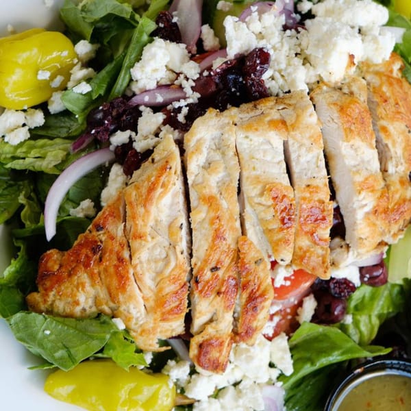 Grilled chicken salad with feta, olives, red onion, and pepperoncini from The Rusty Onion.